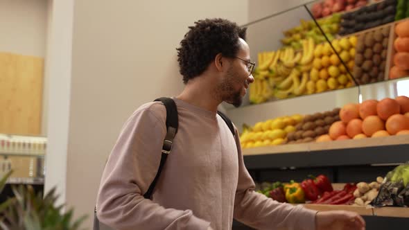 Vegan Buyer Choosing Fresh Vegetables in Farm Shop