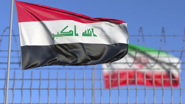 Flags of Iraq and Iran Separated By Barbed Wire Fence