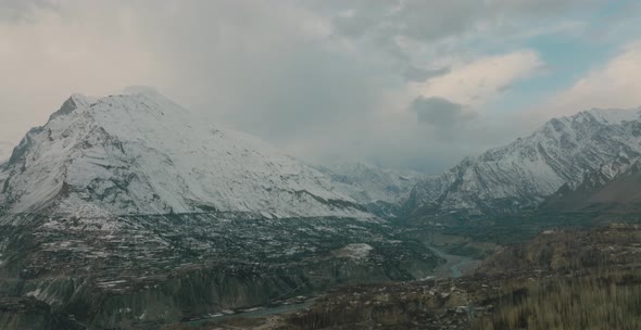 Aerial Panoramic View Of Snow Capped Mountains In Hunza Valley