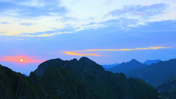 Time Lapse of a Silhouetted Blue Mountains and Horizon at Fagaras Mountains