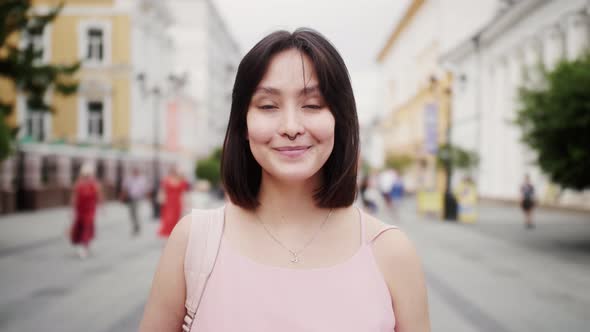 Portrait of Lovely Young Asian Woman Smiling and Looking at Camera