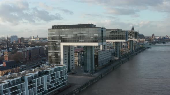 AERIAL: View Over Rhine River in Cologne with Futuristic Kranhaus, Crane House Apartments, Office