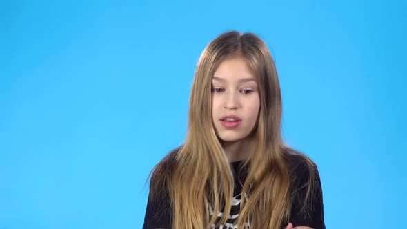 Girl Looking Unhappy, Saying No, but Then Rejoicing, Clapping Hands.