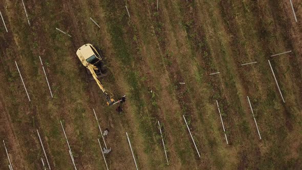 a Specialized Tractor Drives Posts Into the Ground