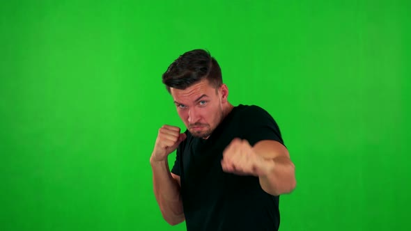 Young Handsome Caucasian Man Does Box - Green Screen - Studio