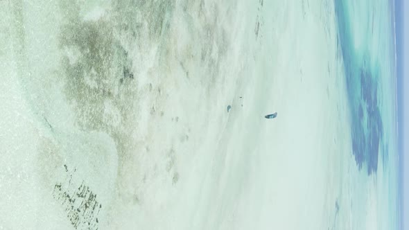 Vertical Video of Low Tide in the Ocean Near the Coast of Zanzibar Tanzania Aerial View