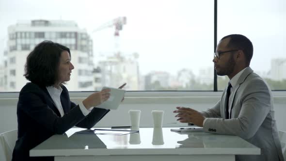 Business Consultant Talking with Client in Office