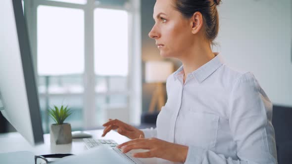 Woman Is Typing on a Computer Keyboard. Concept of Remote Work