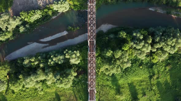 Train Moving on Bridge Above a River