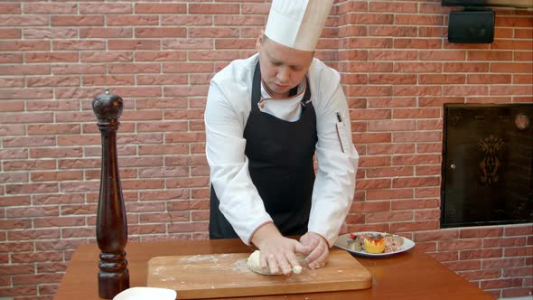 Chef Kneading a Dough
