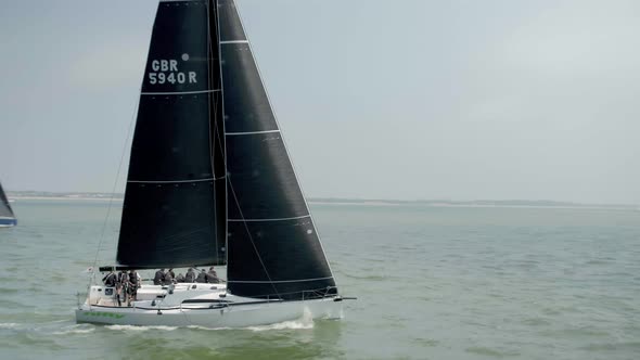 Sailing Team Competing in a Fast 40 Sailing Race