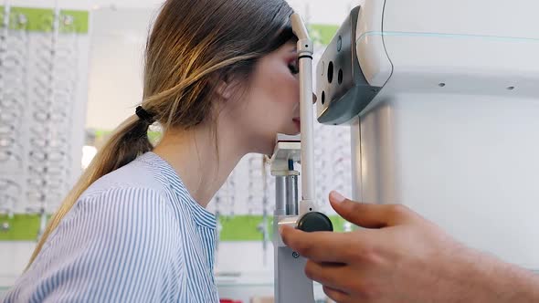 Eye Test. Optometrist Testing Woman Eyesight On Modern Equipment