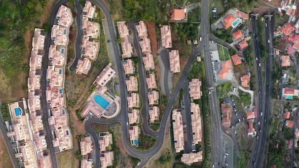 Top View of a Residential Block with Surrounded with Winding Road