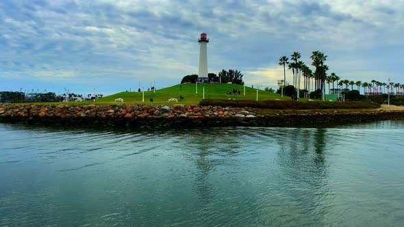 Panning up shot of the Light House in Long Beach California with some cool looking clouds.