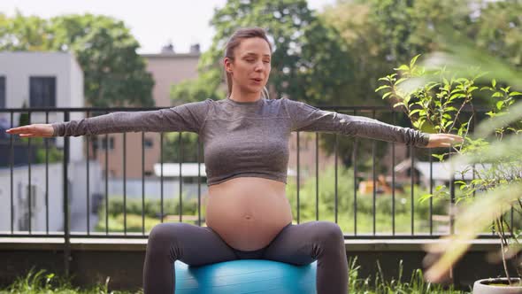 Pregnant woman during the exercise at home. Shot with RED helium camera in 8K