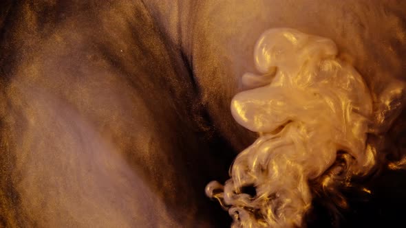 Ink Being Poured Into Water,Yellow and Black. Inks in Water. Colorful Abstract Smoke Explosion