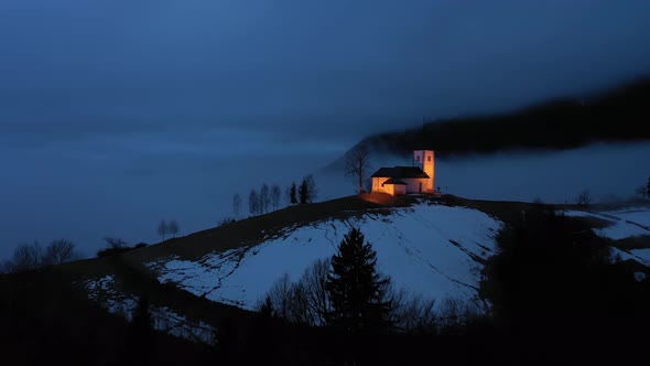 Church of St. Primoz and Felicijan at Night. Jamnik, Slovenia. Aerial View