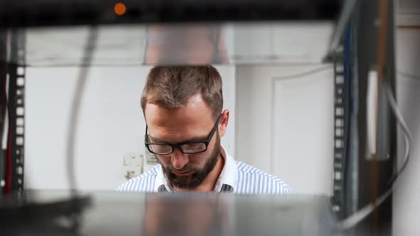 Engineer Working in Data Room