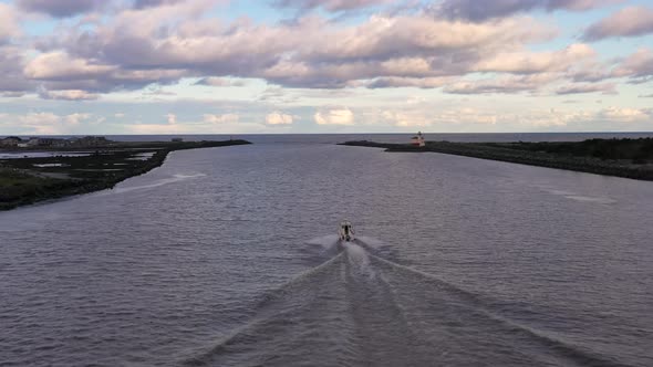 Fishing boat leaves port of Bandon, Oregon out to the open ocean. Drone follow.