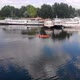 Drone Shot of People on Kayak Swimming Near Boats - VideoHive Item for Sale