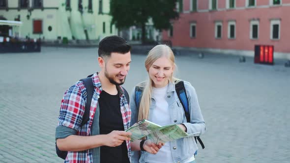 Tourists with Map Looking for New Historical Place in City Center