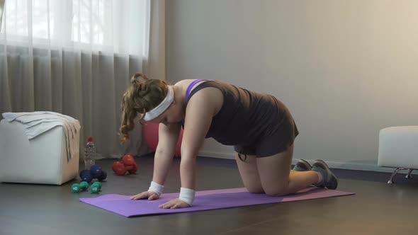 Confident Lady Doing Physical Exercises Strengthen Back, Trying to Lose Weight