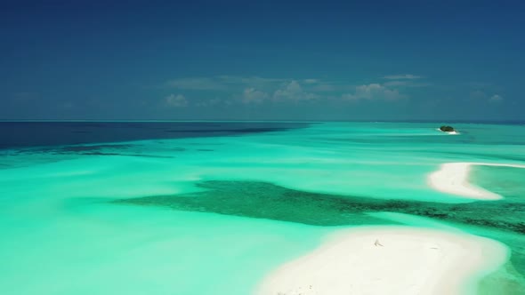 Aerial drone view panorama of paradise shore beach time by shallow water with bright sandy backgroun