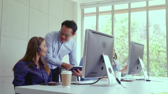 Customer Support Agent or Call Center with Headset Talking to Customer on Phone