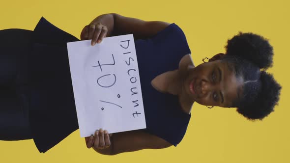 Woman Holding Discount Sign