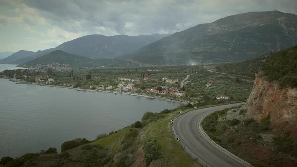 Aerial view of coastal road along seaside in Greece.