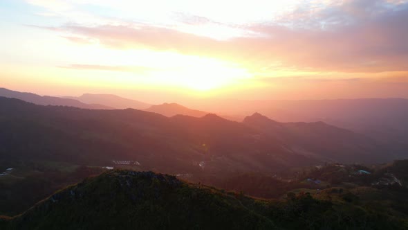 4K Aerial view over the mountains at sunset. Drone Flight Footage