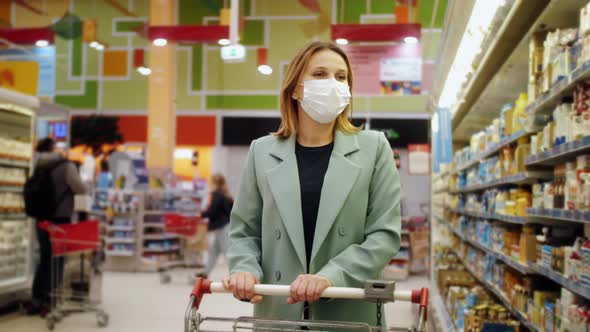 Woman in Medical Face Mask Buys Basic Necessities Hygiene Items and Food