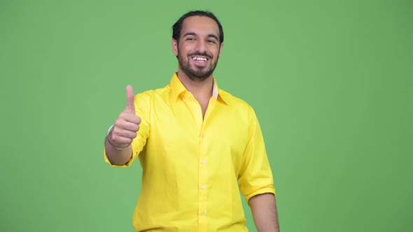 Young Happy Bearded Indian Businessman Giving Thumbs Up