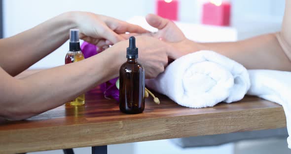 Masseuse Makes Manual Massage of Hands Closeup