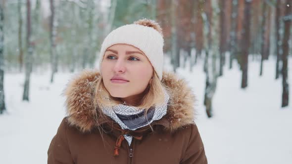 Snowing in Forest Woman in Winter Clothes Walking and Admiring the Nature