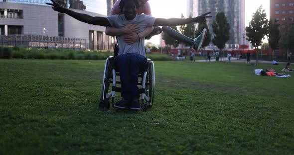 Happy friends with disability having fun at park city