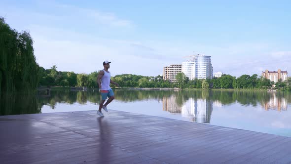 Healthy Young Athlete Training with Jump Rope Near City Lake