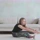 Young  woman with prosthetic leg does stretching back bending exercise - VideoHive Item for Sale