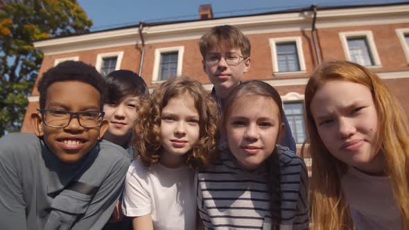Portrait of Diverse Children Friends Looking at Camera Standing Outdoors
