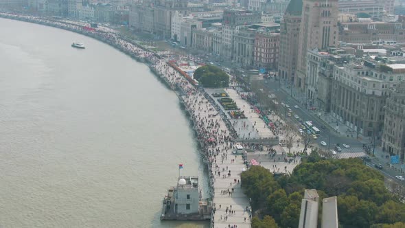 Crowd of People on Bund Waterfront. Shanghai City, China. Aerial Shot