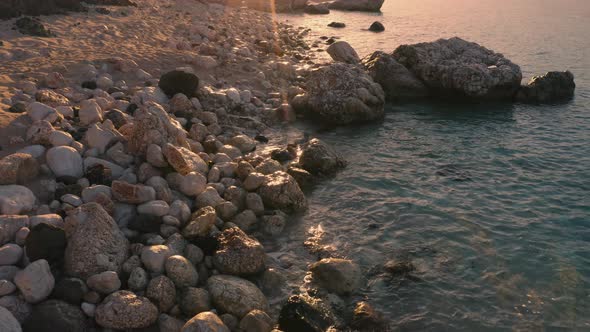 Rocky Coast and Tranquil Ocean Water on a Summer Sunny Day