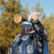 An Old Shaman in Traditional Costume Shakes a Bell. - VideoHive Item for Sale