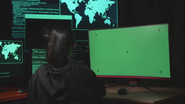 Young Girl Hacker Hacking With Isolated Mock-Up Green Screen And Code On Multiple Computer Screens