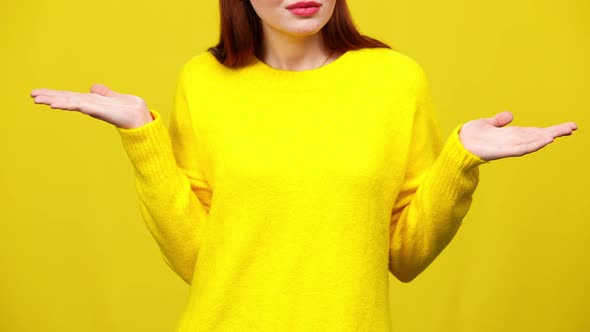 Unrecognizable Young Irritated Woman Gesturing in Slow Motion at Yellow Background