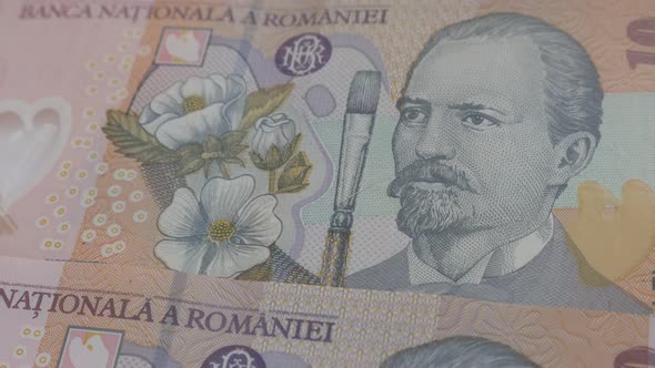 Paper money of  Romania 3840X2160p 30fps UltraHD video - Slow tilt over Romanian national currency l