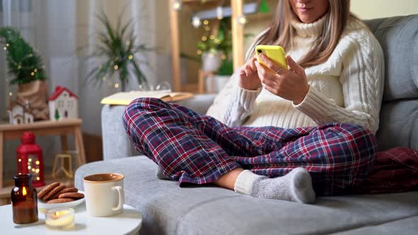 Cozy Vibes woman scrolling cellphone