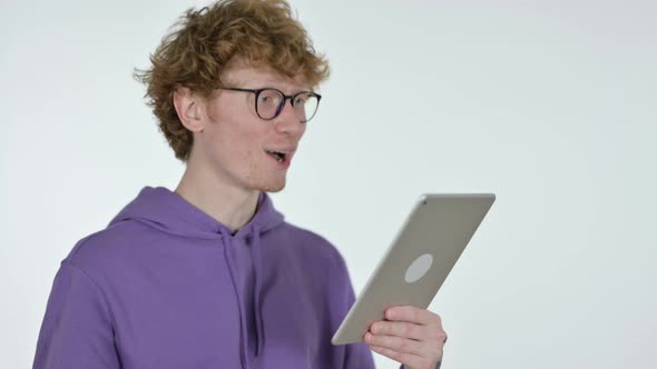 Success on Tablet By Redhead Young Man, White Background