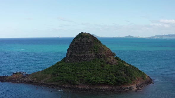 Aerial close-up panning shot of Mokoli'i island off the coast of O'ahu, Hawaii. 4K