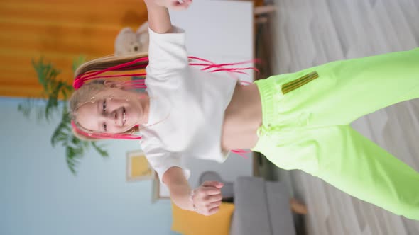 Vertical Screen Child Blogger Shoots Dance Video for a Social Network Beautiful Little Girl with