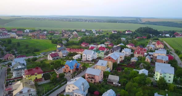 Village houses near the big city, shooting from a quadcopter